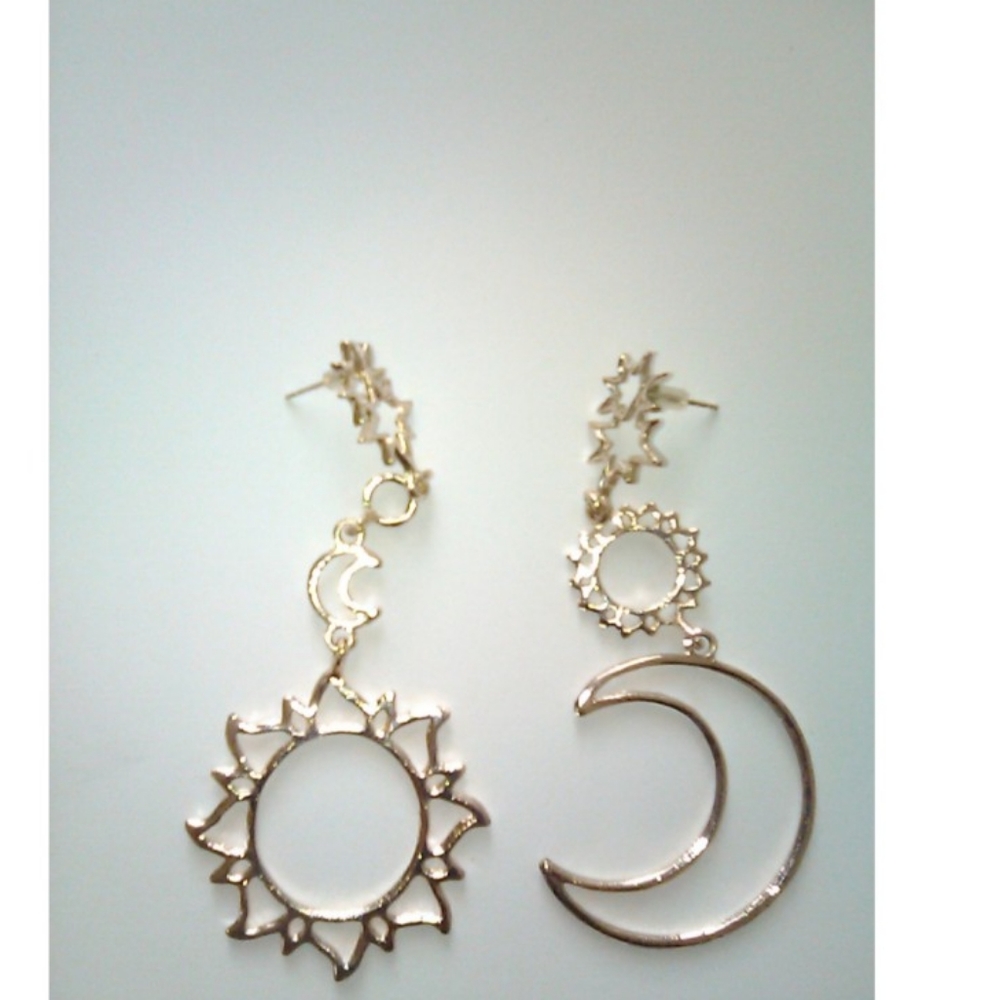 Jazzy  rose gold assymetrical earrings